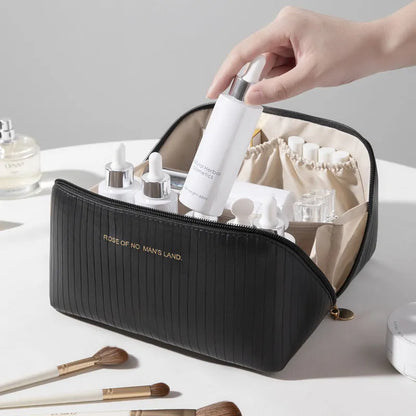 Beige cubic makeup bag with vertical pattern measuring 22.5 by 12.5 by 12.5 centimetres