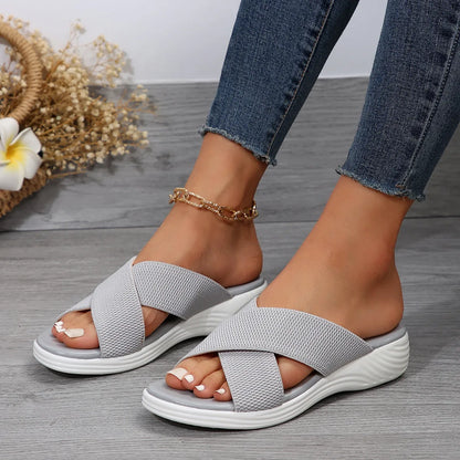 Black women's flat wedge slippers with a peep-toe fish mouth design and thick rubber sole