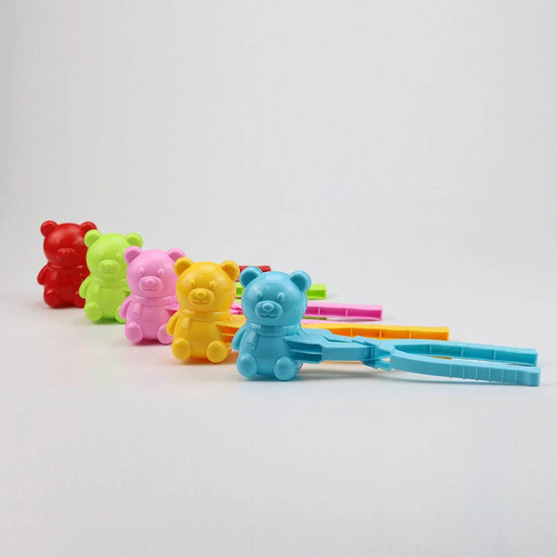 Red heart-shaped snowball maker clip for kids, perfect for winter play