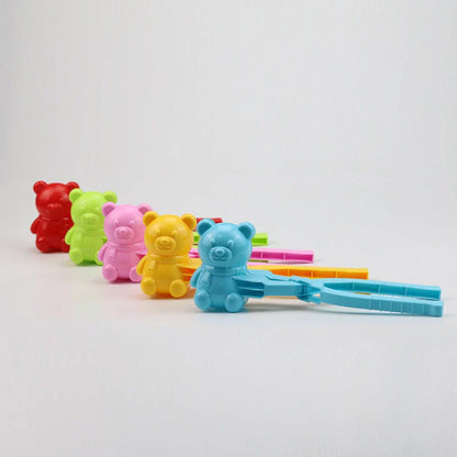 Red heart-shaped snowball maker clip for kids, perfect for winter play