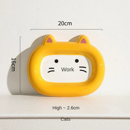 Four ceramic animal-themed pet bowls with frog, panda, pig, and fortune cat designs and silicone non-slip bases