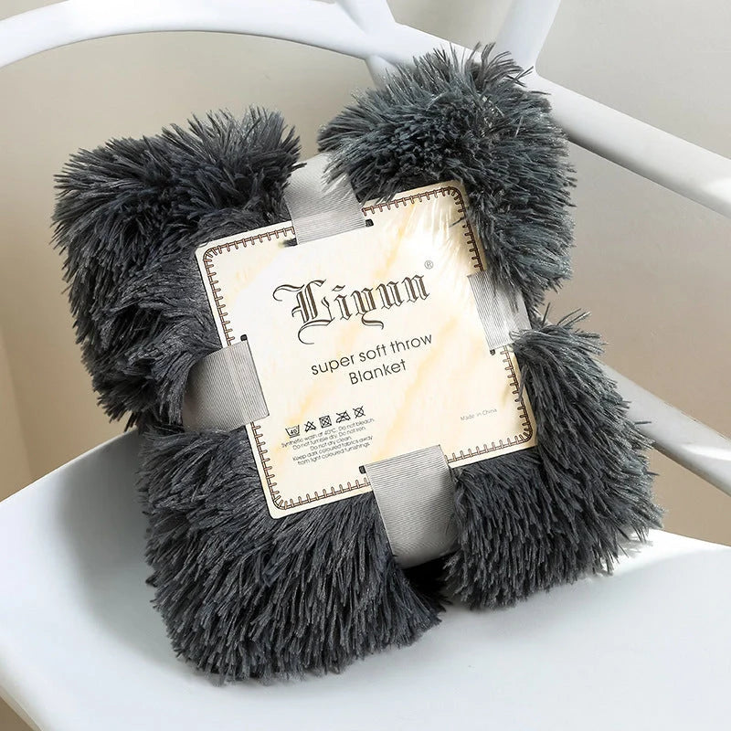 Soft coral fleece blanket in various colours and sizes for home and travel comfort