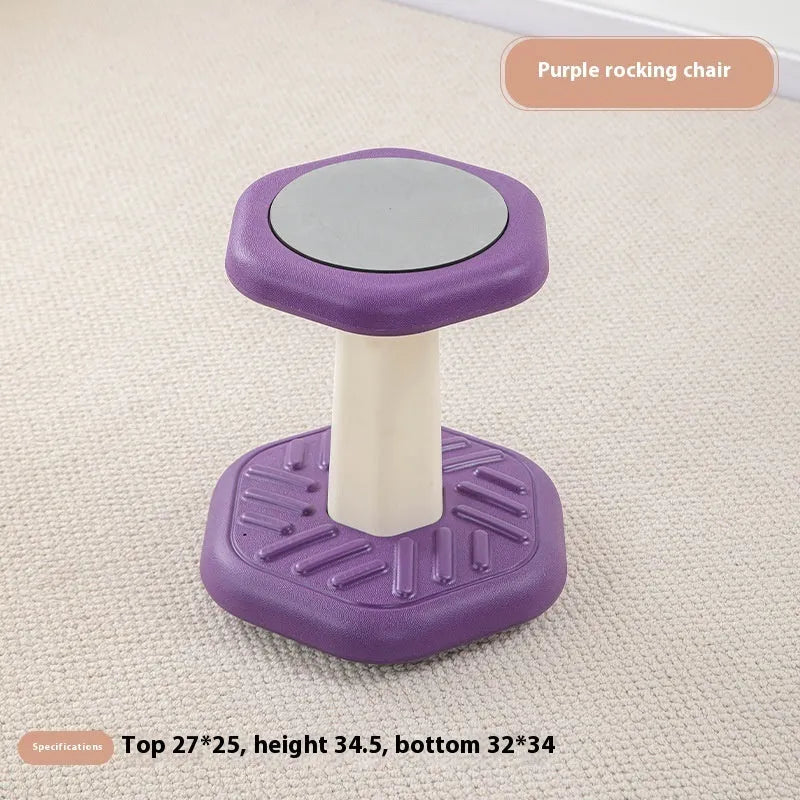 Balance children's plastic rocking stool in blue colour on a wooden floor.