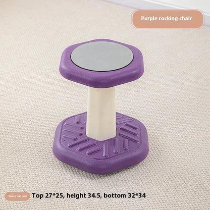 Balance children's plastic rocking stool in blue colour on a wooden floor.