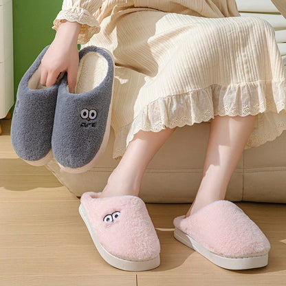Stylish and cozy cartoon-inspired slippers with plush material and non-slip rubber soles, perfect for keeping feet warm and comfortable at home.