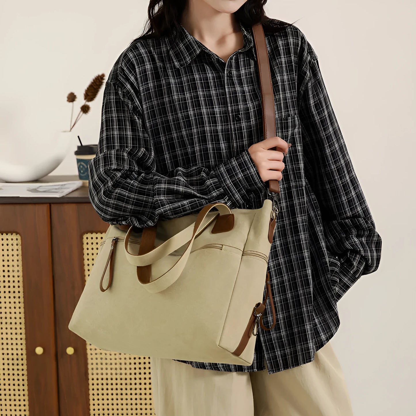 Large grey retro-style canvas shoulder bag with a horizontal square shape and multiple internal pockets.
