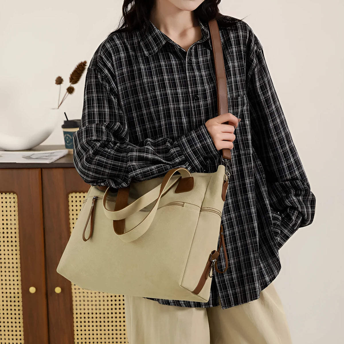 Large grey retro-style canvas shoulder bag with a horizontal square shape and multiple internal pockets.