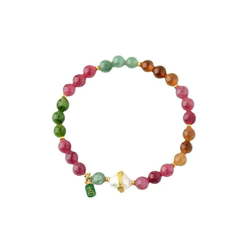 Chalcedony and tourmaline geometric bracelet with 6.5mm beads on a wrist.