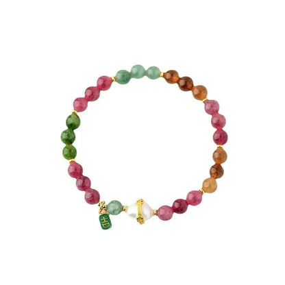 Chalcedony and tourmaline geometric bracelet with 6.5mm beads on a wrist.