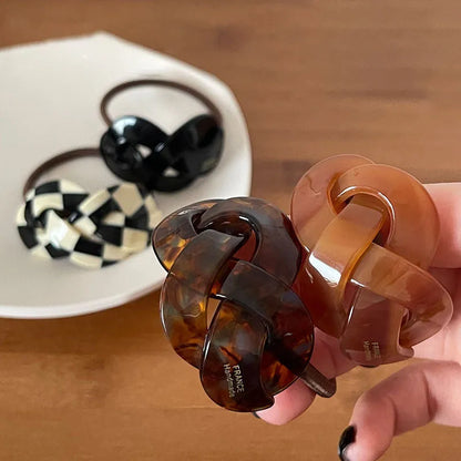 Seamless acetate hair rope ring in black, plaid, caramel, and dark coffee colours.