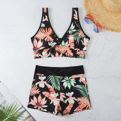 Women's two-piece swimsuit set showing sleeveless bikini top and printed boxer-style briefs in a multi-colour pattern.