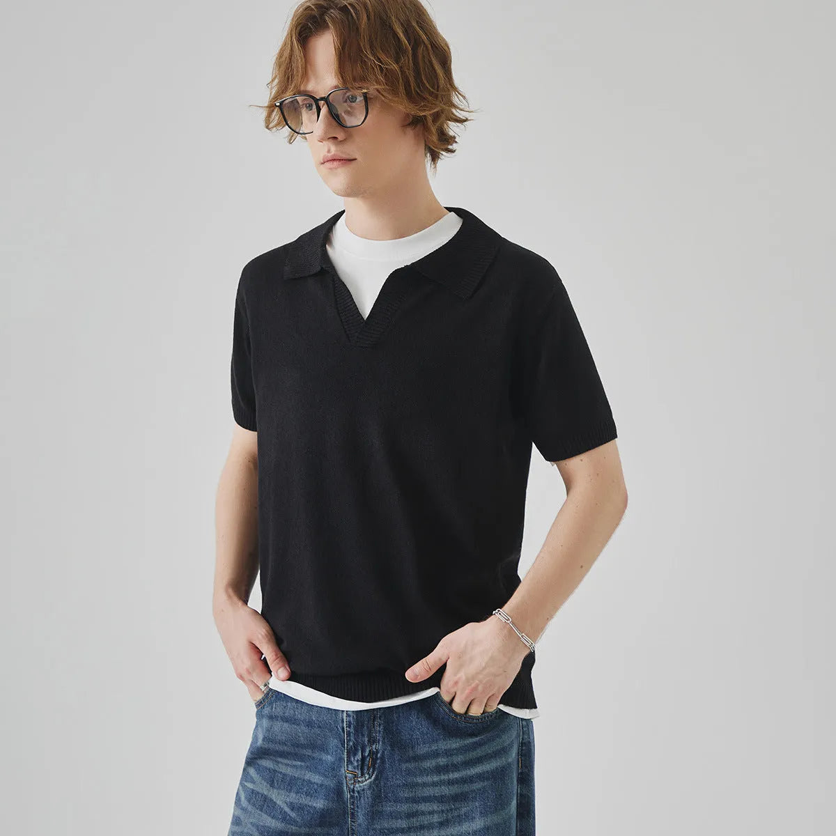Knitted short-sleeved polo collar casual T-shirt in a solid colour on a hanger.