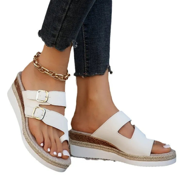 White patent leather wedge sandals with woven design and peep toe on rubber sole