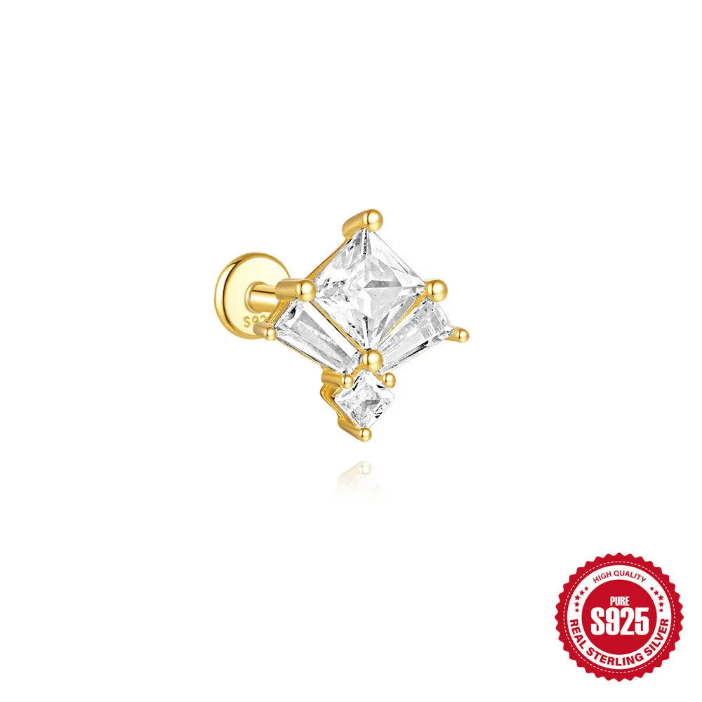 Close-up of golden-toned sterling silver double stud earrings with a delicate chain and sparkling zircon stone.