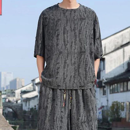 Men's thin knit two-piece suit with half-sleeve top and cropped trousers in black or grey colour options