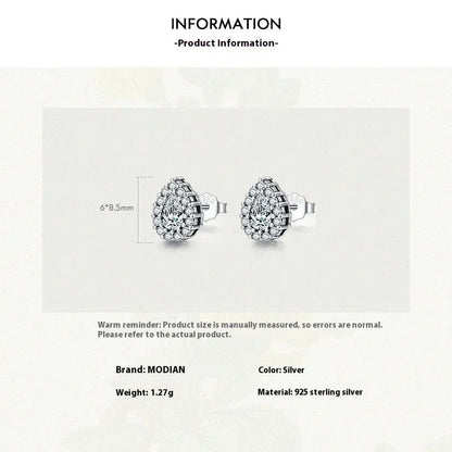 A pair of drop-shaped sterling silver ear studs with a diamond-cut finish.