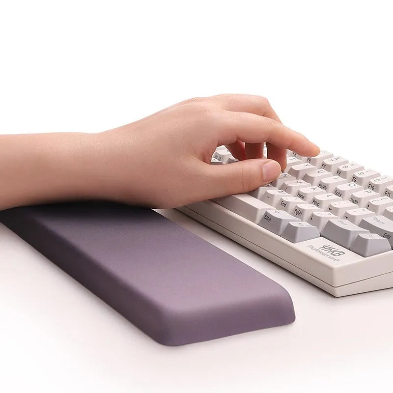 Square cloth-covered silica gel wrist rest mouse pad on a desk.