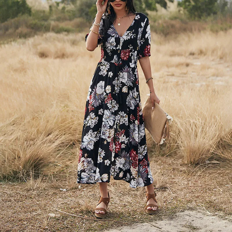 Floral summer beach dress with V-neck, elastic waist, and large hemline in mid-length design