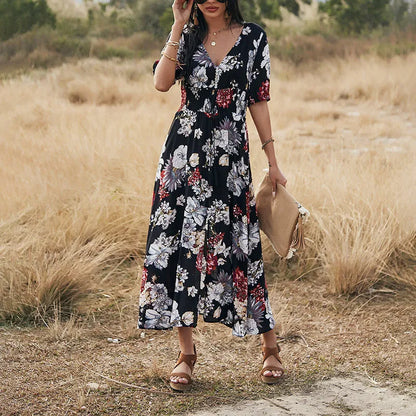Floral summer beach dress with V-neck, elastic waist, and large hemline in mid-length design