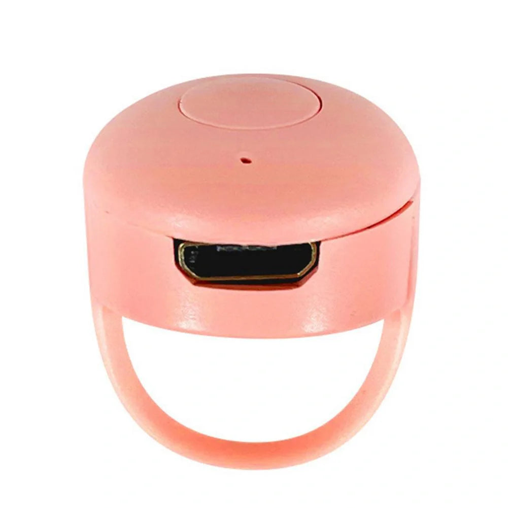 Bluetooth remote control ring for mobile phones in yellow, blue, and pink