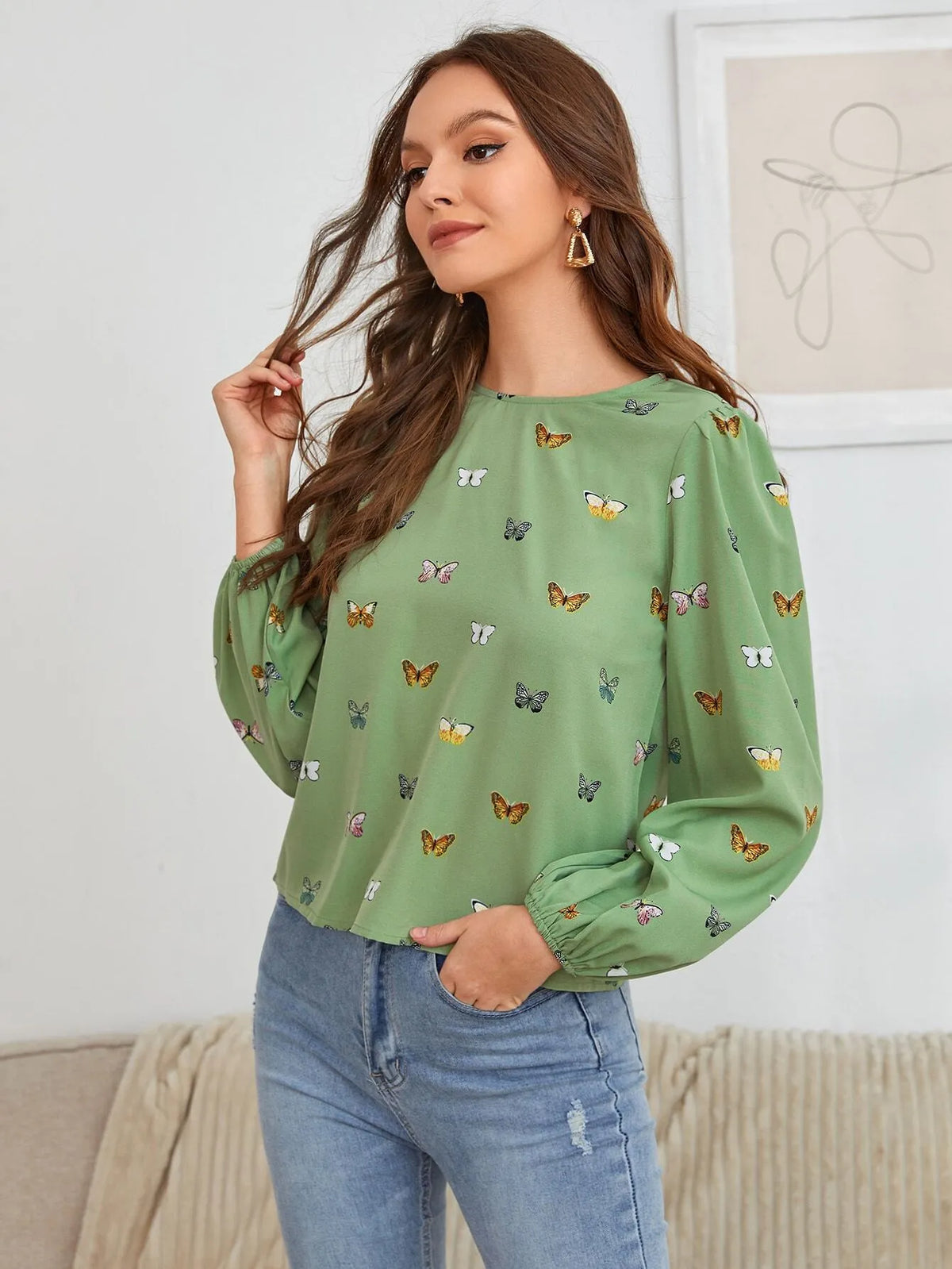 Women's butterfly print long-sleeved shirt in loose fit available in green or orange colours