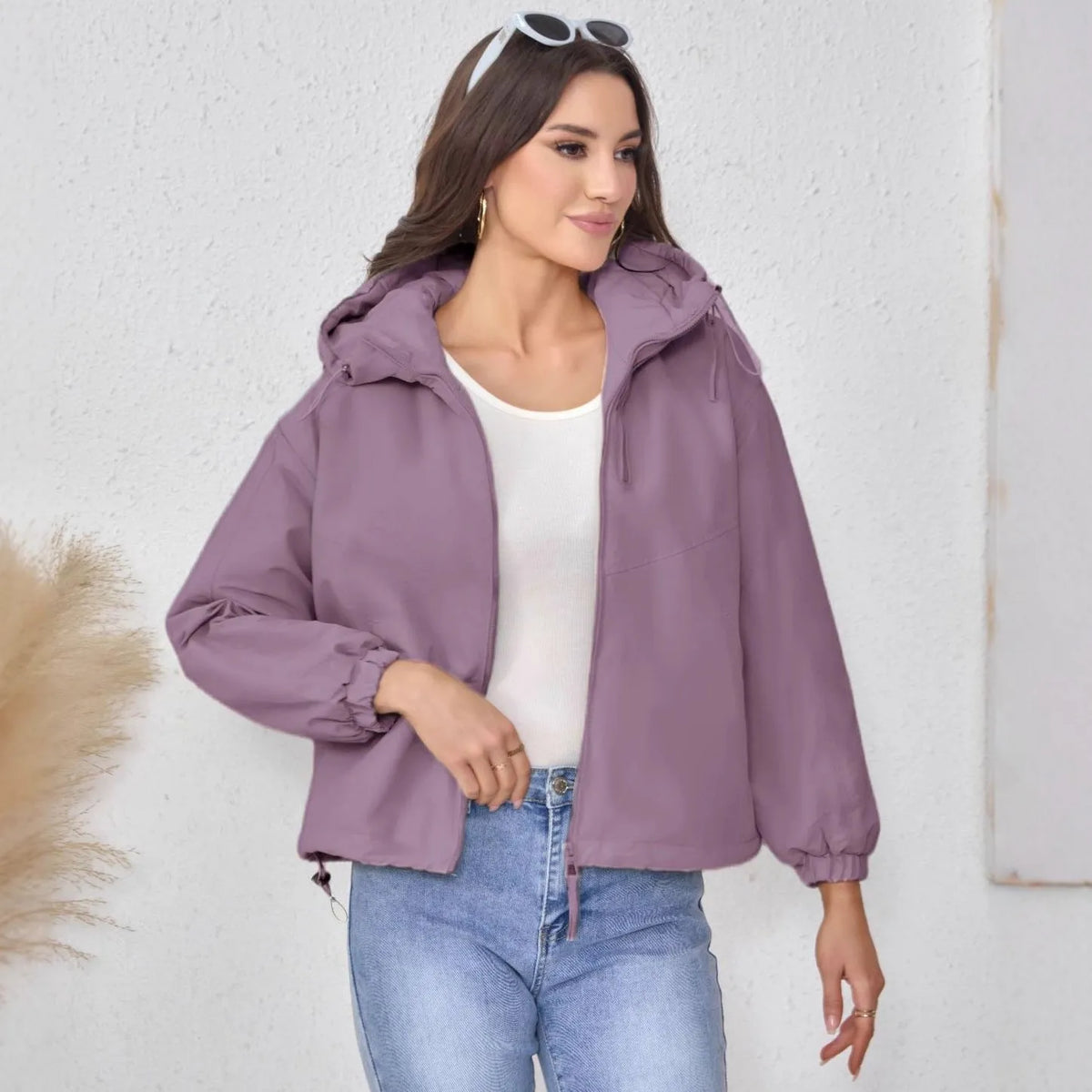 Women's loose-fit hooded shell jacket in black, grey, or purple.