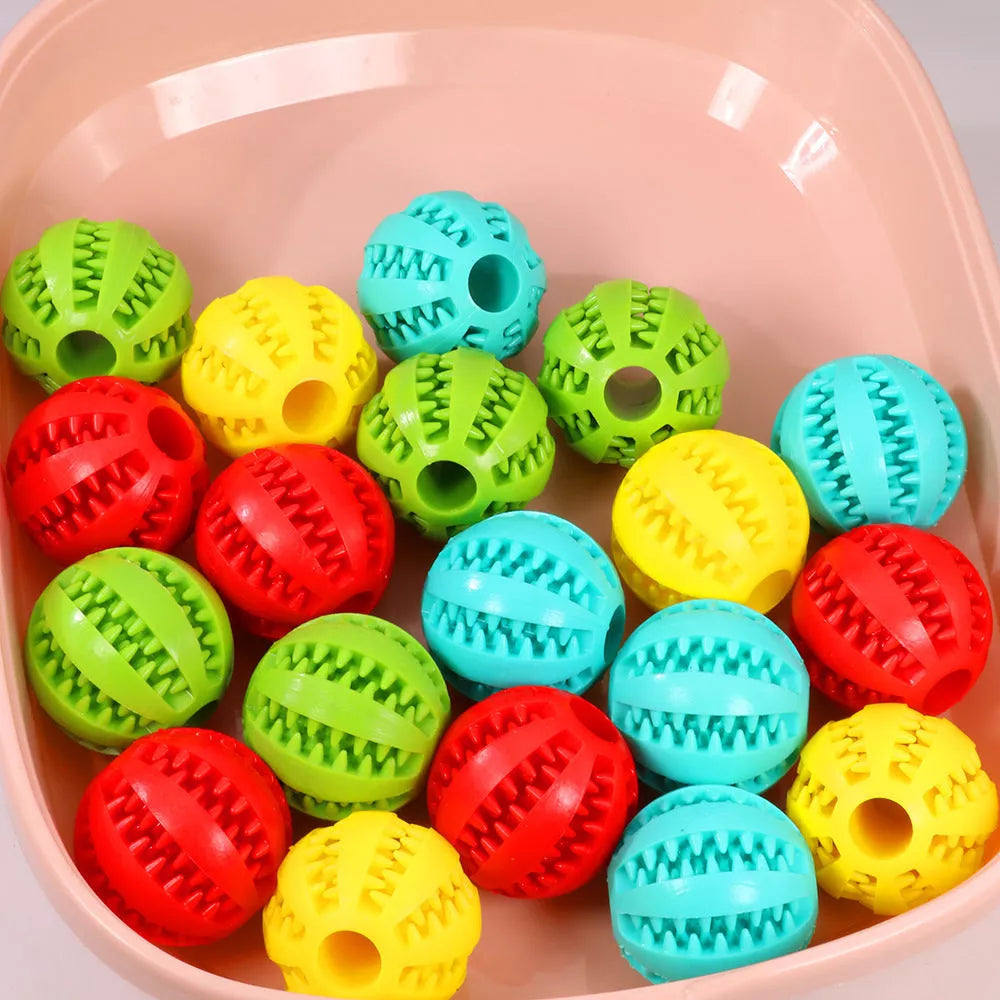 Vibrant watermelon-coloured rubber dog molar toy for durable chewing fun