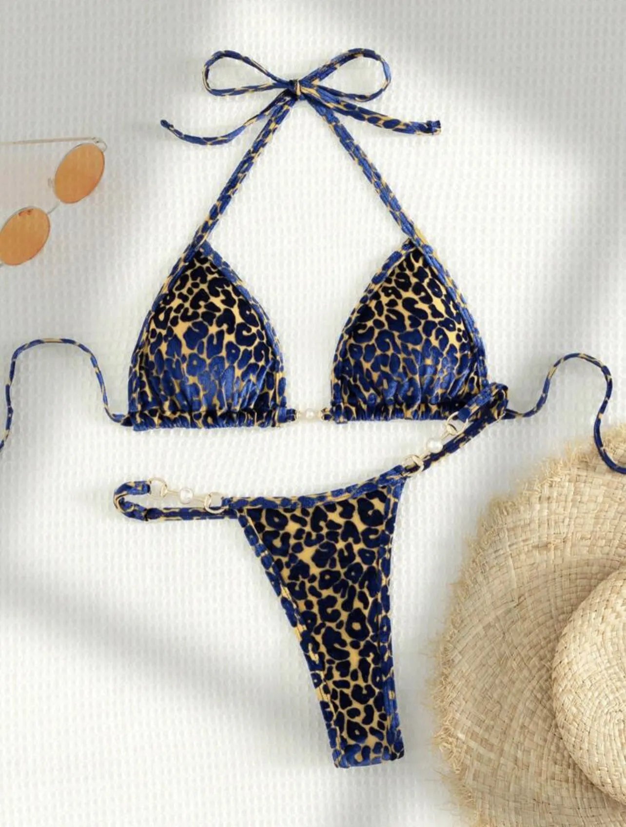 Women's leopard print bikini swimsuit set in various colours including blue and green, shown in triangle and skirt styles.