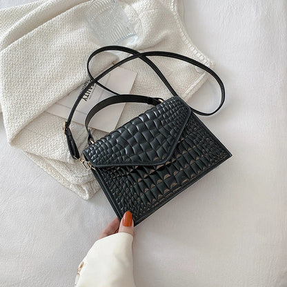 Clamshell handbag with crocodile pattern and soft handle in various colours