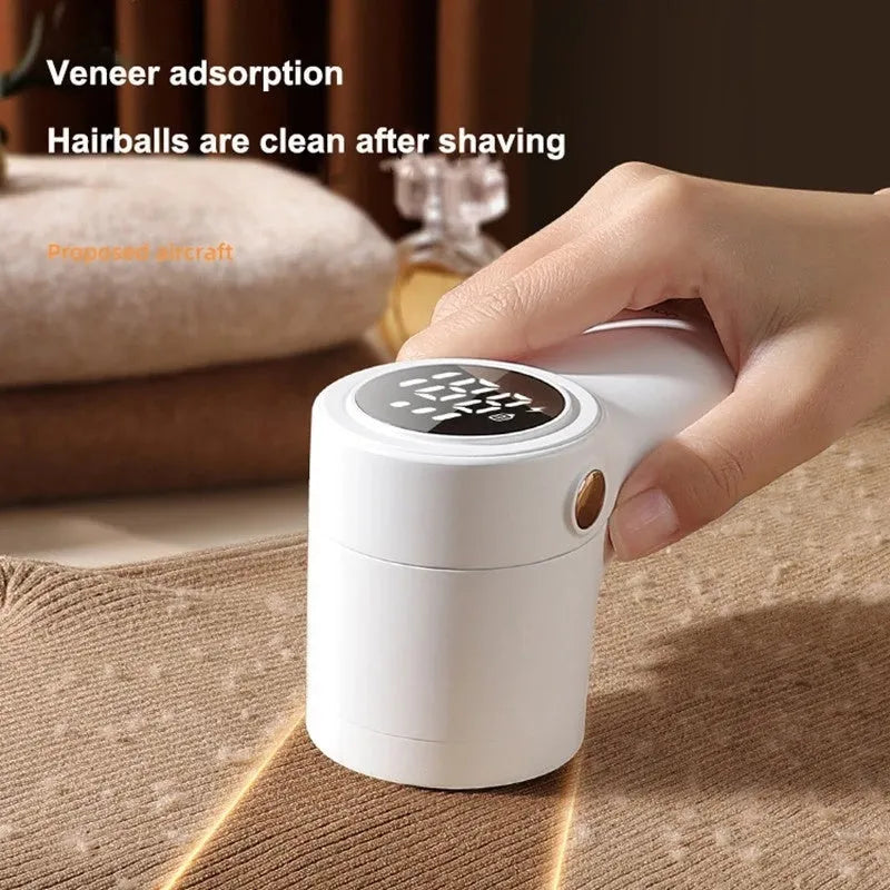 White electric lint remover with digital display showing six stainless steel blades and USB charging port