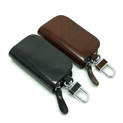 Genuine leather car key case with zipper closure showing black and brown colour options