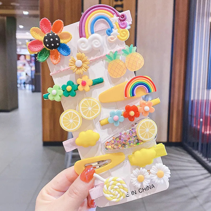 Assortment of colourful toddler hair clips and barrettes with candy, rainbow, fruit, and butterfly designs
