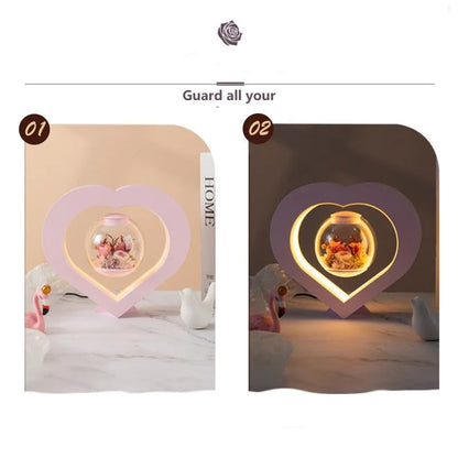 Pink preserved rose ornament with Bluetooth speaker and LED light on wooden table