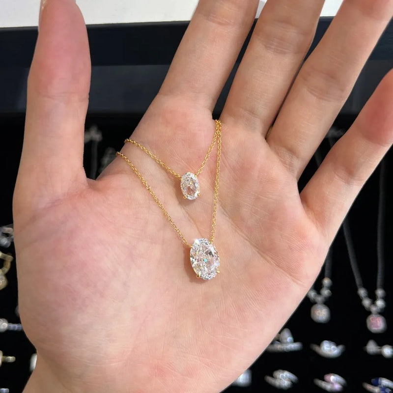 Sterling silver necklace for women with oval ice flower design in 925 silver, available in gold or platinum electroplated finish and two pendant sizes, geometric style fine jewellery for daily wear.