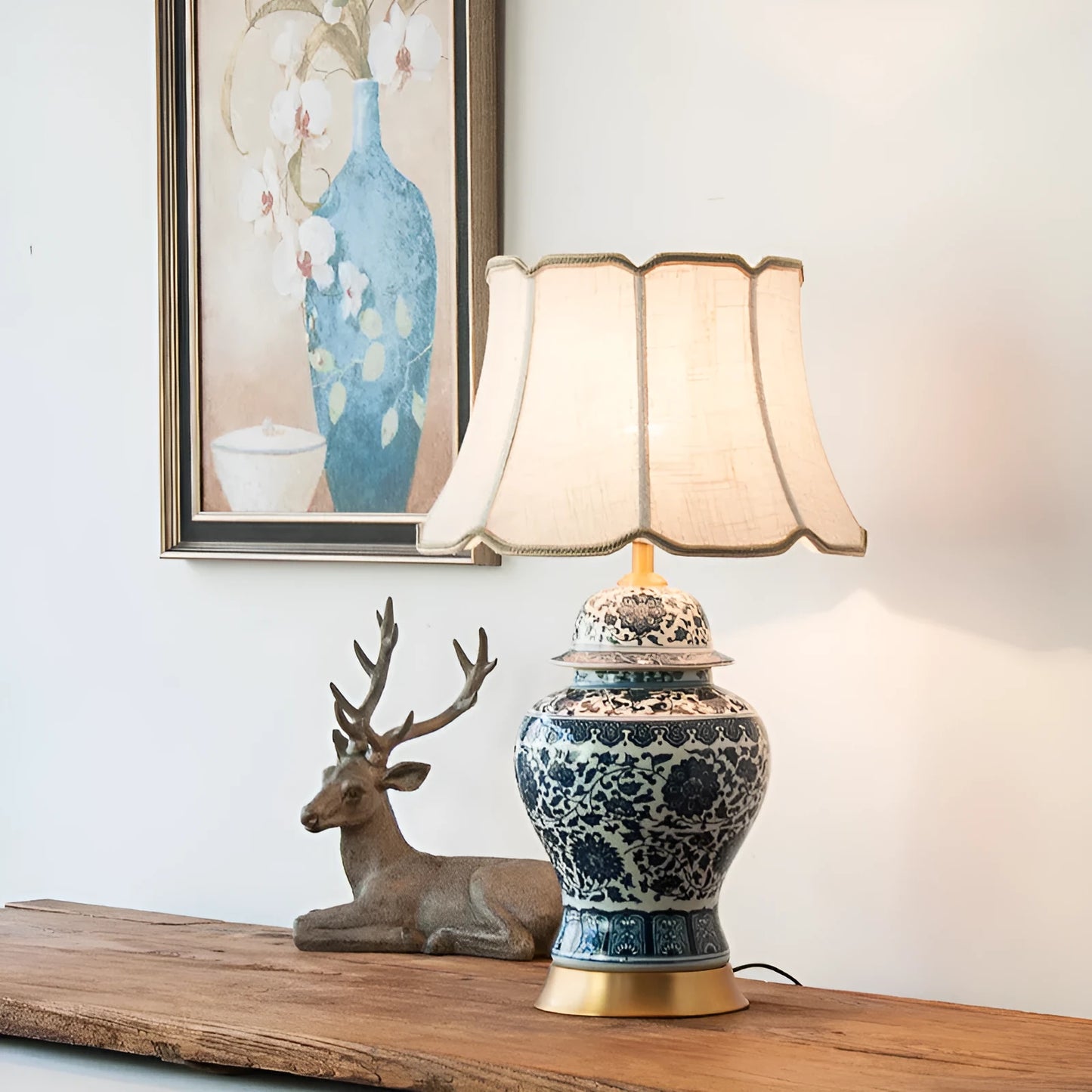 Chinese blue and white porcelain table lamp with cloth shade on bedside table