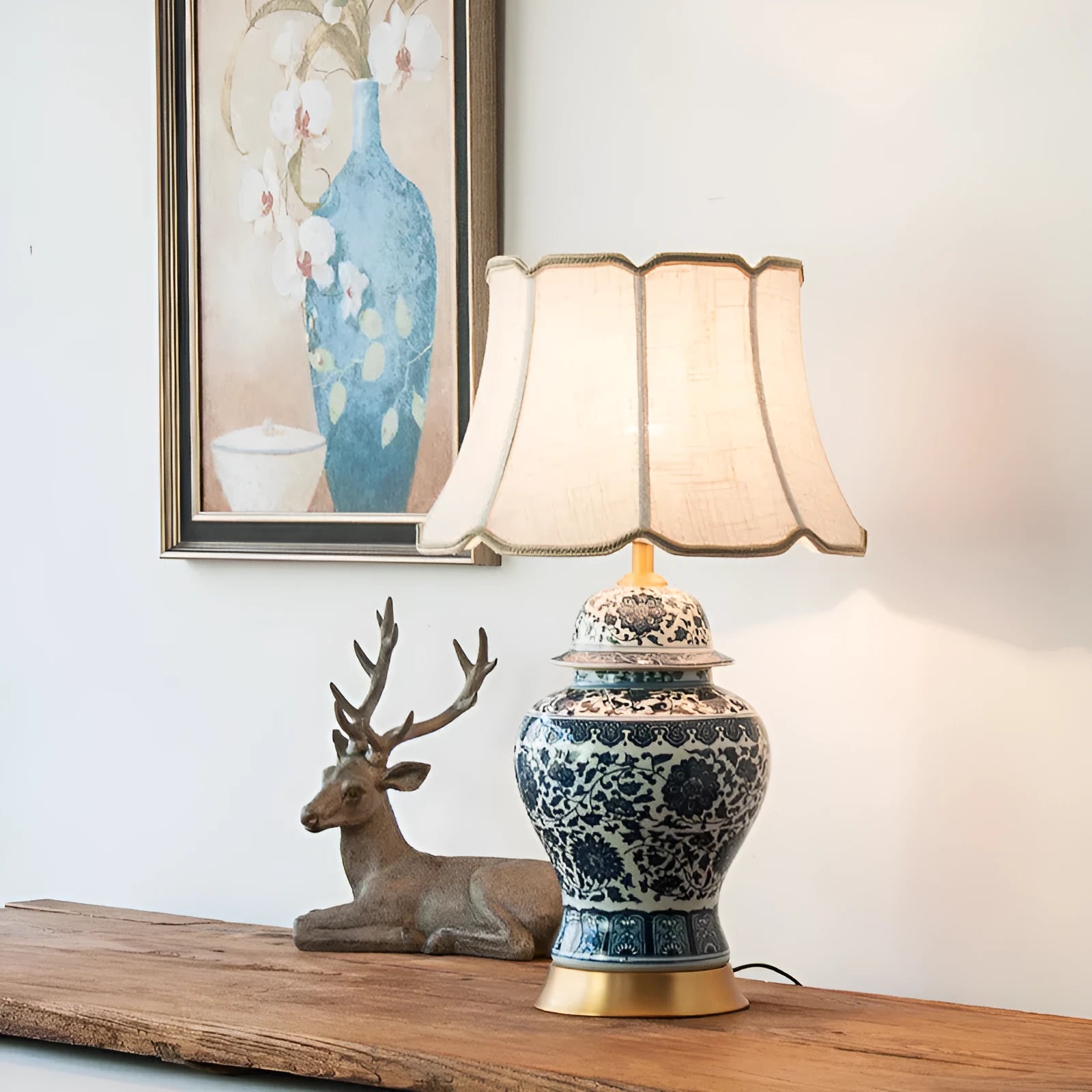 Chinese blue and white porcelain table lamp with cloth shade on bedside table