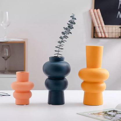 Nordic minimalist ceramic vase with glazed finish in blue, yellow, and orange options