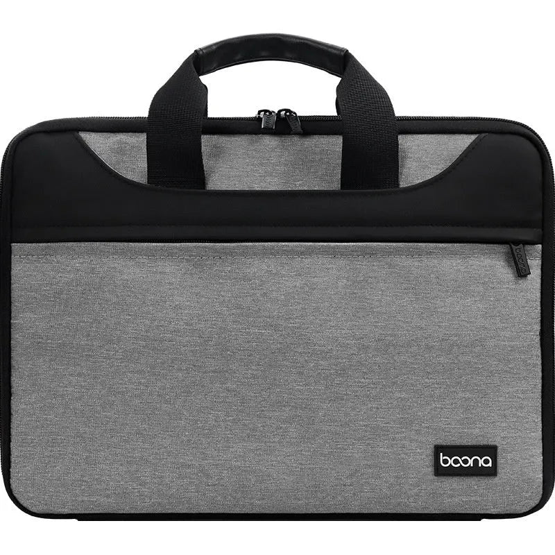 Black Oxford cloth laptop bag fully opened showing main compartment, with soft carry handle.