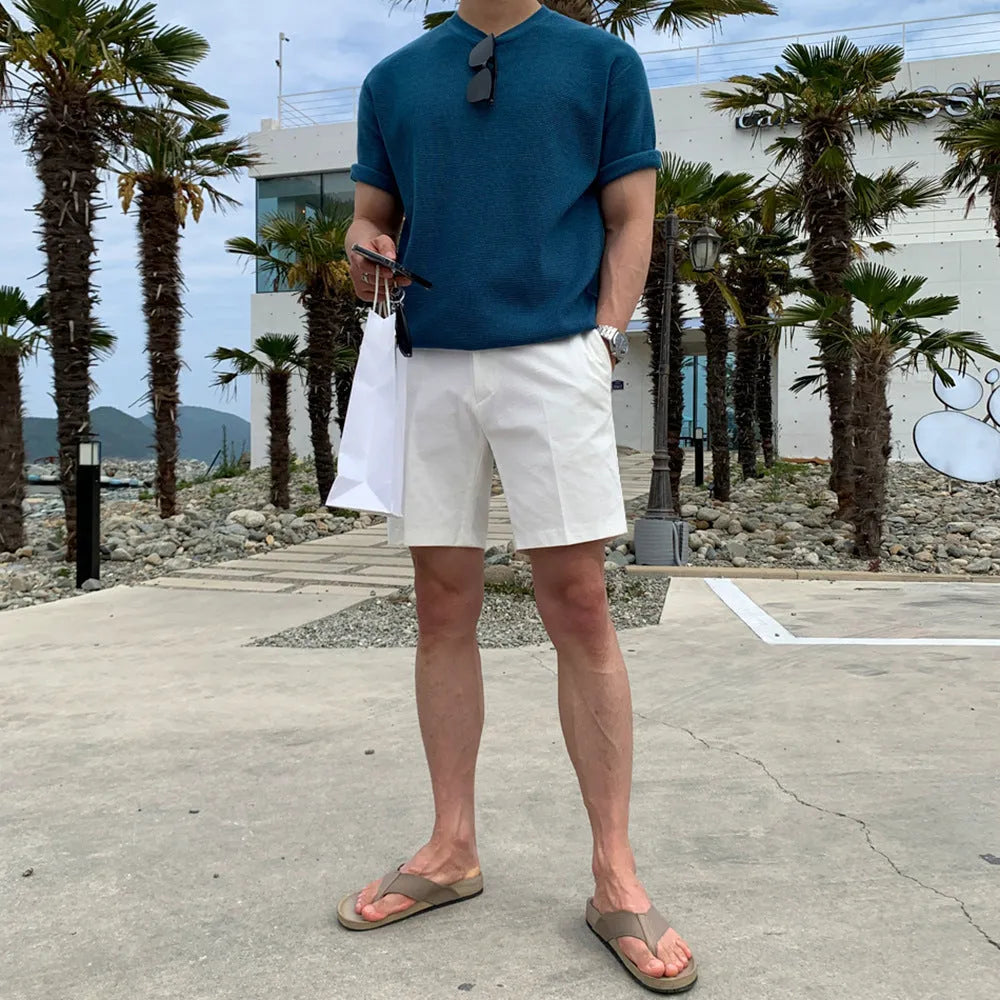 Men's loose straight casual shorts in black, khaki, and white solid colours.
