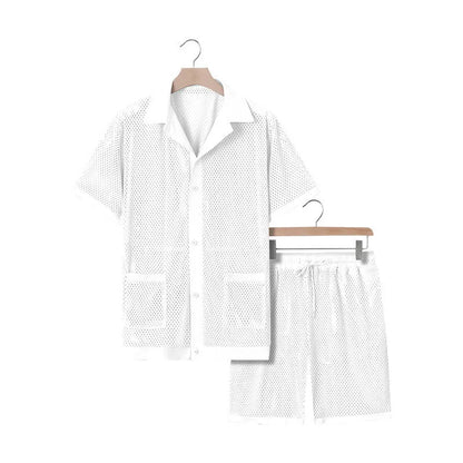 Light blue see-through beach shorts suit with matching cardigan on a summer background.