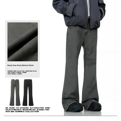 A pair of black straight-leg cotton jeans with a mid-waist fit and horn-style leg opening on a plain background.