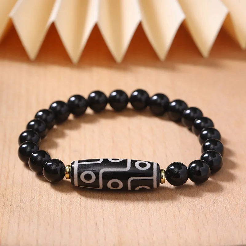Obsidian-coloured agate Tibet dzi bead bracelet with traditional ethnic design