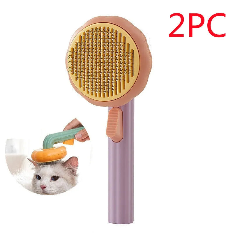Hand-held pumpkin-coloured pet brush with stainless steel needles for grooming cats and dogs