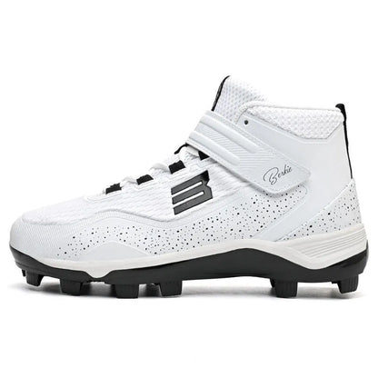 Black and white mid-top baseball sneakers with Velcro strap on a grass surface