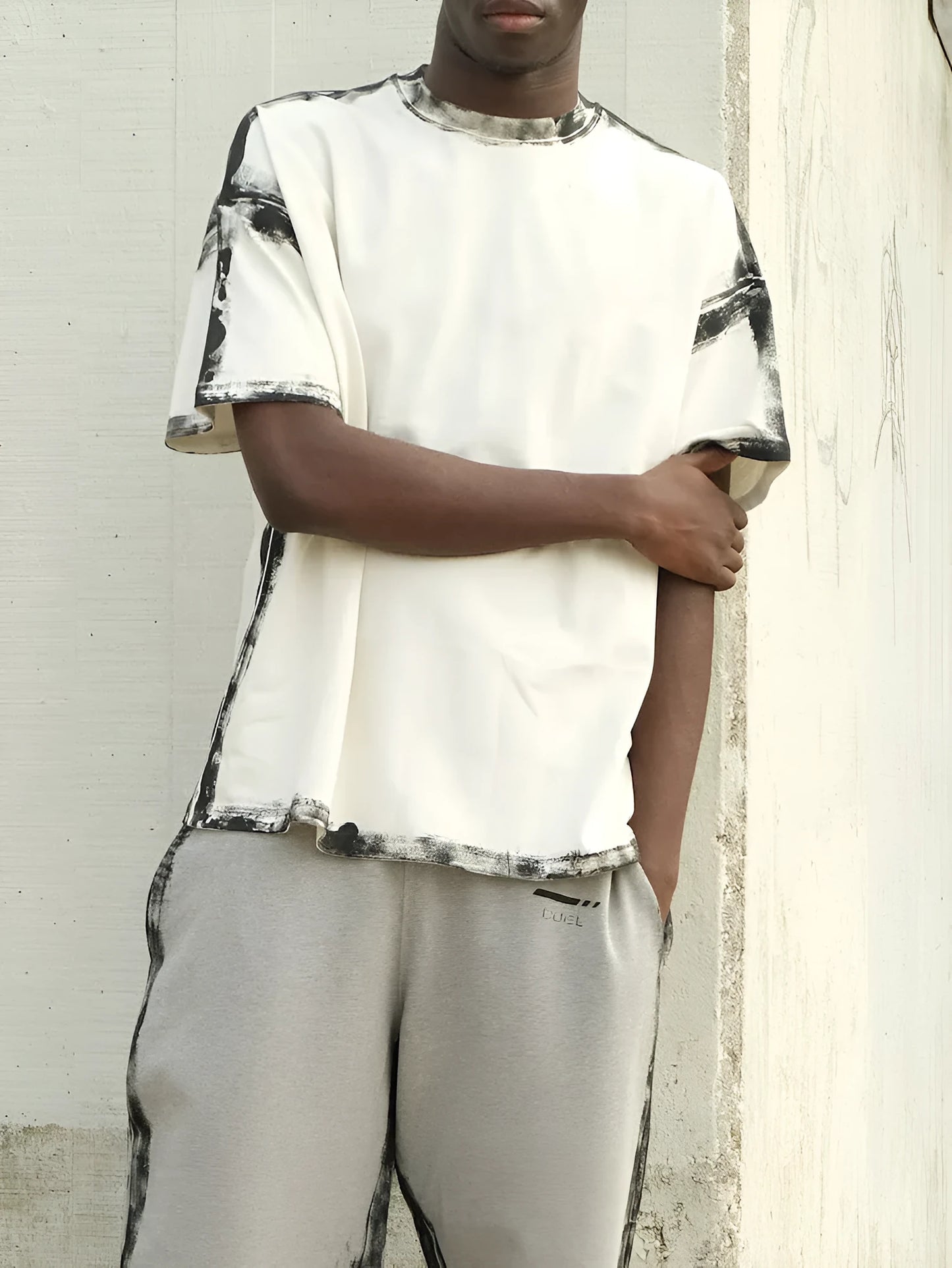 White casual short sleeve top with draped design and printing detail on regular fit polyester construction
