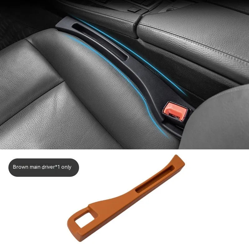 Black car seat gap storage box organiser with compartments and carrying handle between vehicle seats