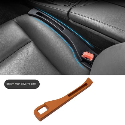 Black car seat gap storage box organiser with compartments and carrying handle between vehicle seats