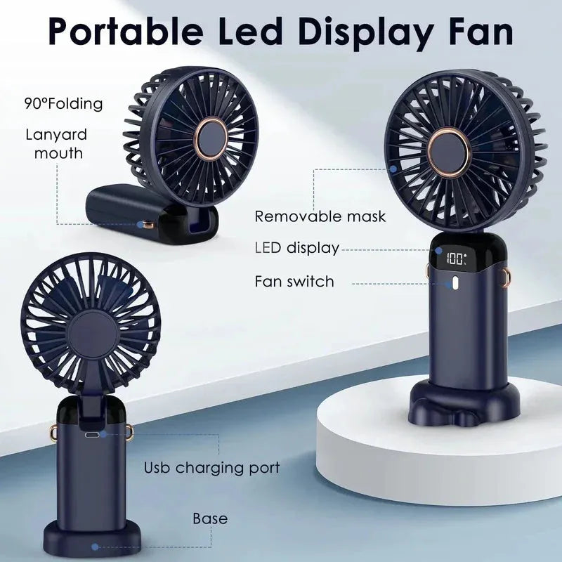 Blue foldable mini handheld electric fan showing its LED display and hanging lanyard.