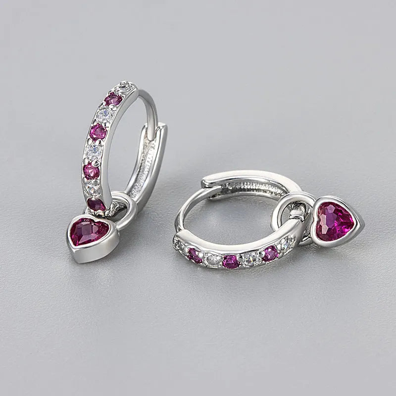 Women's fashion earrings with heart-shaped eardrops, diamond-treated gemstones in gold or white gold plating, approximately 2.5 cm long