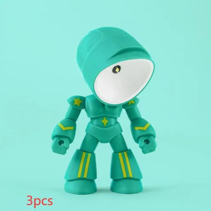 Mini mecha robot hero LED night light with adjustable arms on a desk.